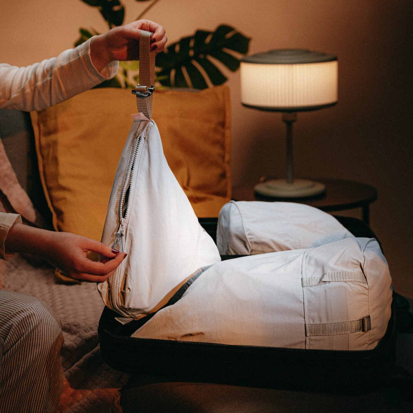 <ol><li> Roll or fold your clothes neatly and place them inside the packing pod.</li><li> Zip up the packing pod securely to keep your items organized and compact.</li><li> Place the packing pods inside your suitcase or travel bag. You can stack them vertically or horizontally to maximize space and keep your belongings organized.</li><li> When you reach your destination, simply unpack the packing pods and place them in drawers or shelves for easy access to your clothes.</li><li> You can also add the strap attachment and use the Packing Pods as a convenient day bag. </li></ol>